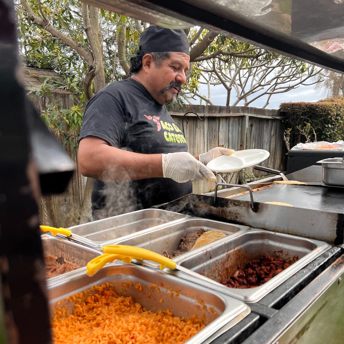 Taqueros chef preparing catering food